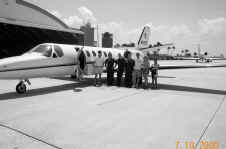 Crew in front of plane